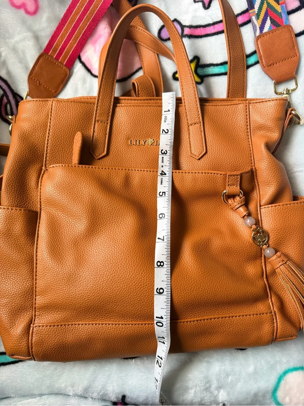 Lily & Jade Tan Leather Tote with Tassel and Colorful Strap